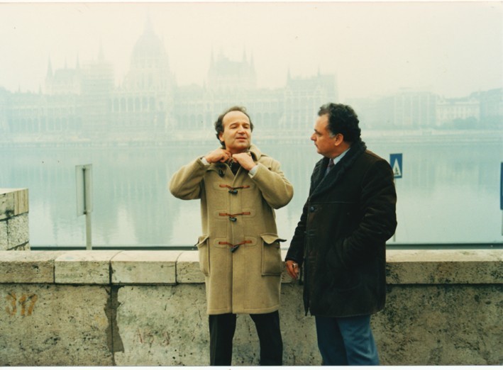 George Petritsis with Dimitris Dimitrakos, the series' special adviser, in Budapest, with the Hungarian Parliament behind them